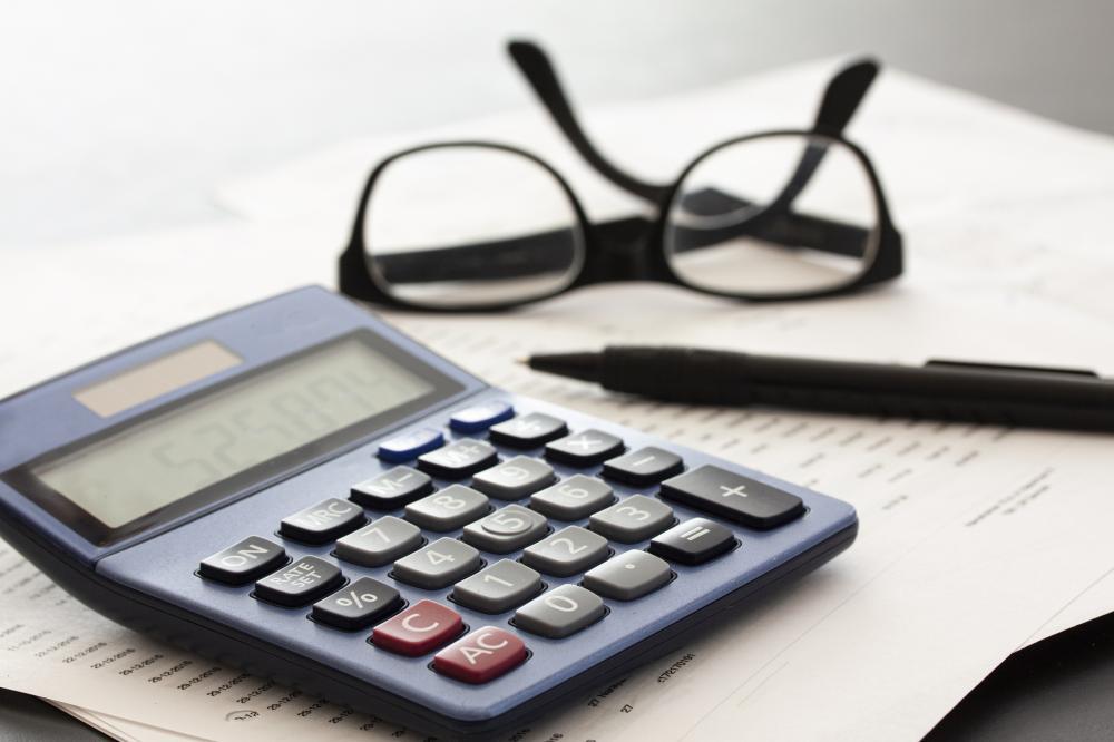 Image of a calculator on an attorney's desk. 